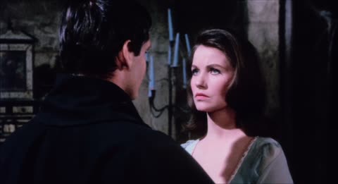 A man and a woman in a dark castle